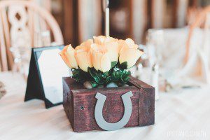 wedding reception centerpiece yellow roses horseshoe