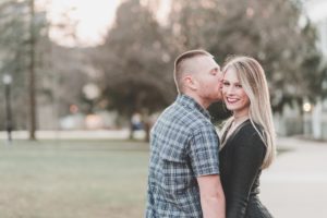 engaged couple kissing smiling west chester university campus proposal
