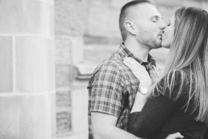 engaged couple kissing engagement ring west chester university proposal